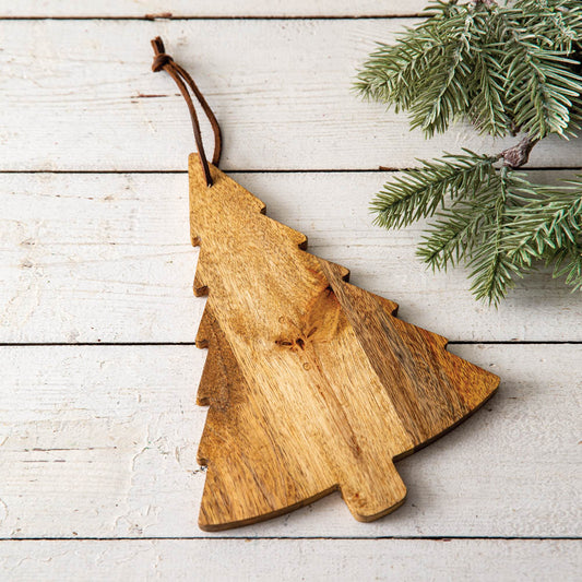 Christmas Tree Wood Board made of high-quality wood, showcasing holiday treats and decorations on a festive table setting.