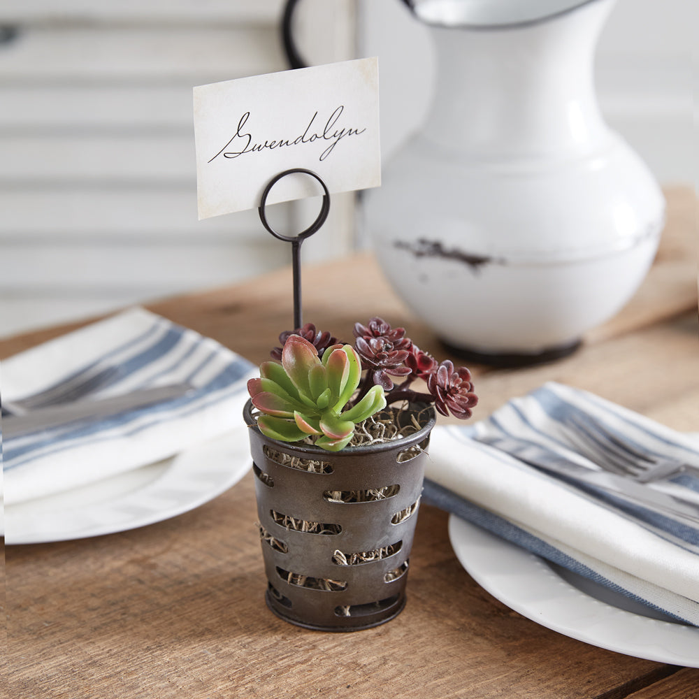 Four metal place card holders shaped like olive bins, perfect for displaying names, treats, or tealights at a party table.