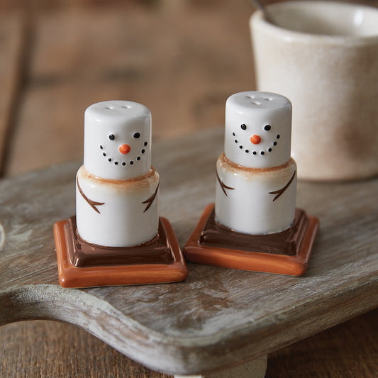 Ceramic salt and pepper shakers shaped like s'mores, featuring a cute design with a rubber stopper for easy refilling.