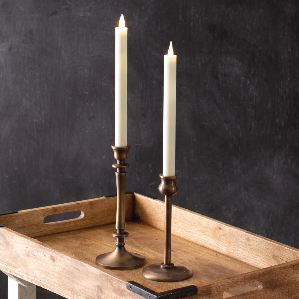 Set of two elegant wax taper candles with realistic flameless glow, remote control, and customizable lighting settings.