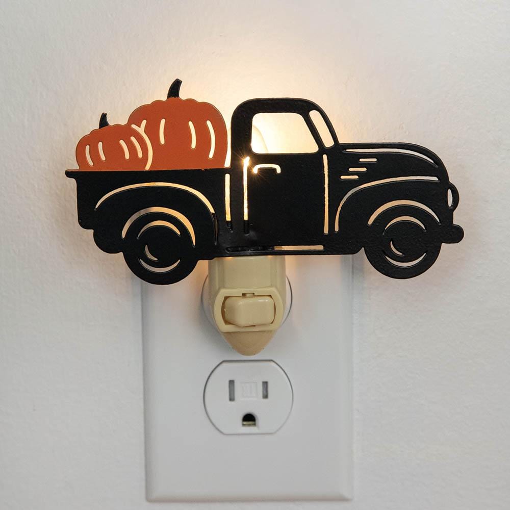 Black Harvest Truck Night Light with a vintage truck design, casting a warm glow; set of four for stylish home illumination.