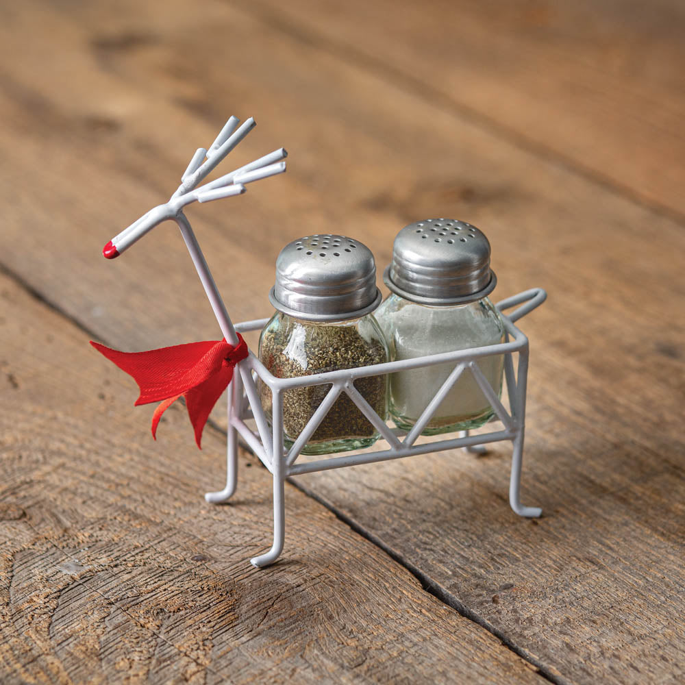 Festive reindeer salt and pepper caddy with a red nose, holding square shakers, adds charm and whimsy to holiday dining.