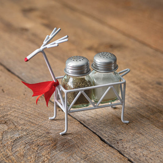 Festive reindeer salt and pepper caddy with a red nose, holding square shakers, adds charm and whimsy to holiday dining.