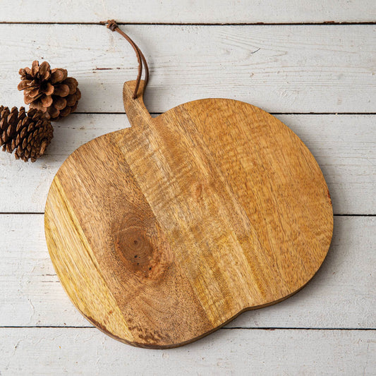 Decorative wood board shaped like a pumpkin, crafted from high-quality wood, ideal for displaying holiday treats and decorations.