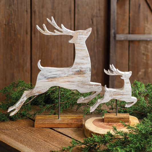 Two distressed wood reindeer with rustic charm, one large and one small, perfect for adding warmth and style to any decor.