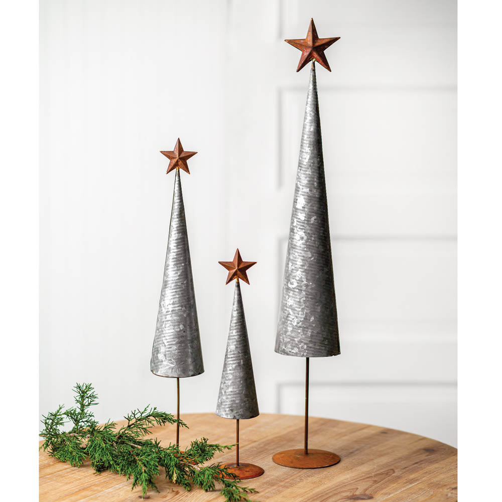 Set of three cone-shaped trees with galvanized metal and rust accent stars, perfect for adding rustic charm to holiday decor.