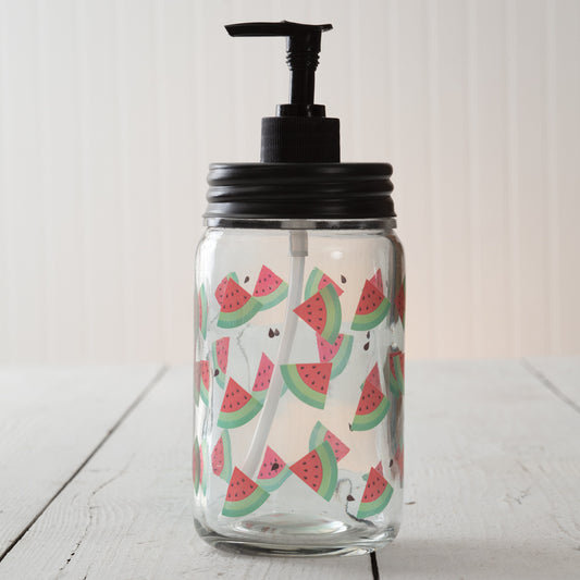 Watermelon soap dispenser with an antique brass lid on a rustic glass jar, perfect for adding charm to a country bathroom.