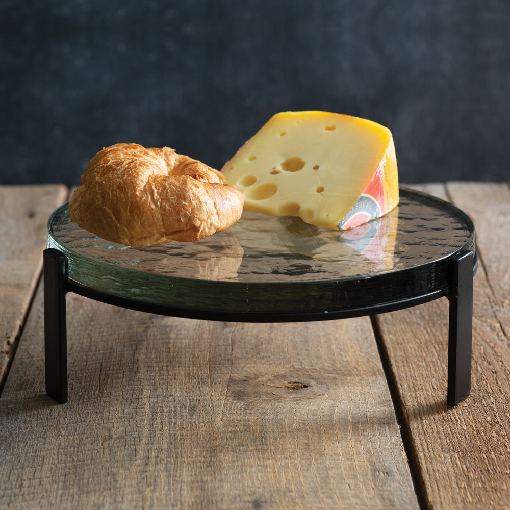 Blocked Glass Dessert Stand with thick glass plate on sturdy black metal legs, showcasing a unique, handmade design.