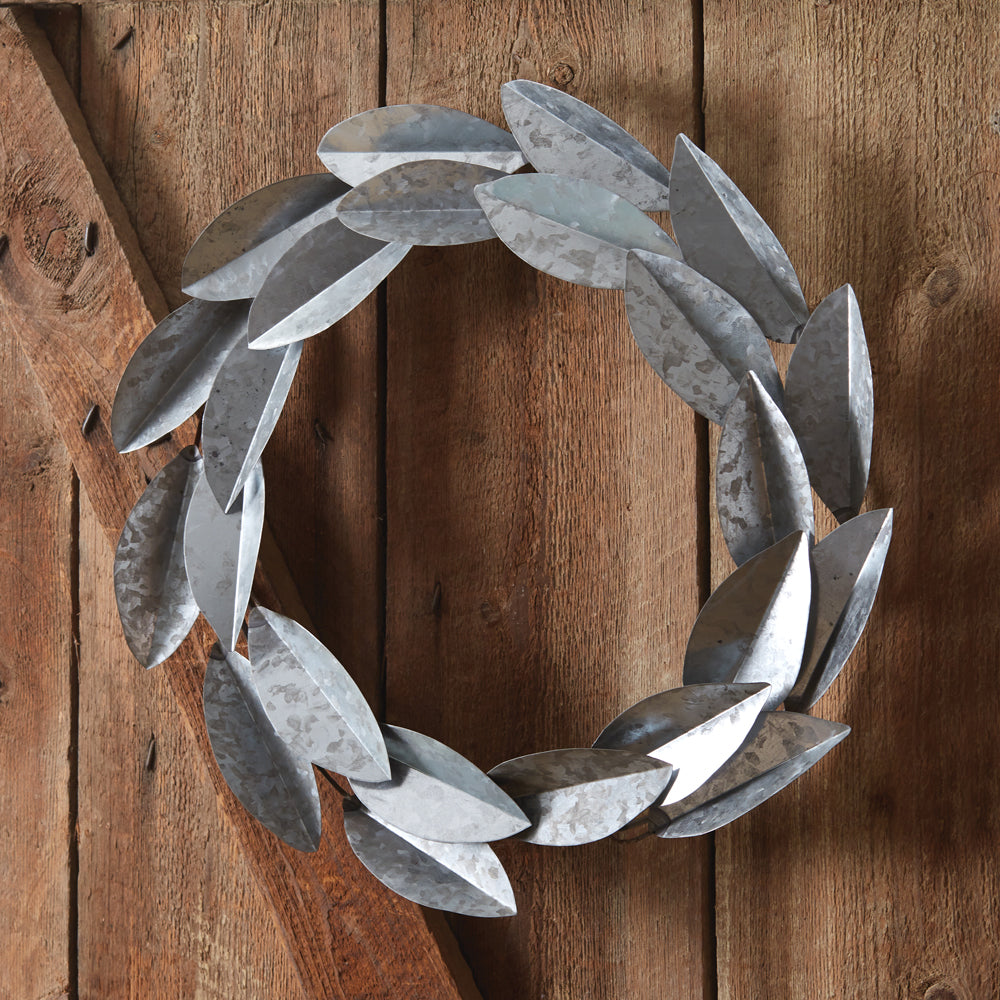 Metal Magnolia Wreath with lifelike magnolia leaves on a sturdy metal ring, perfect for adding farmhouse charm to any space.