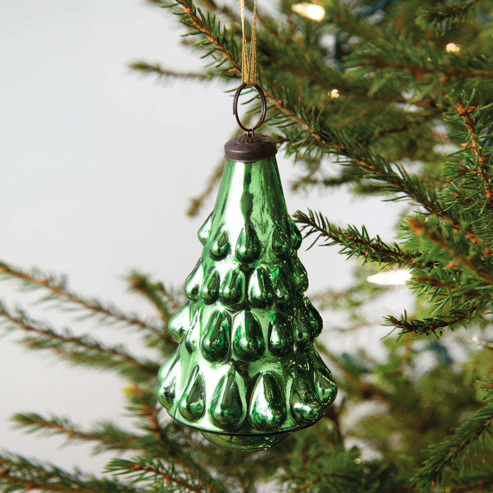 Set of four hand-blown mercury glass ornaments with green Christmas tree design, gold ties, in a decorative gift box.