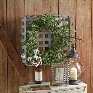 Tobacco basket style shelf with a metal hook, perfect for seasonal wreaths. Rustic farmhouse charm with easy triangle hanger.