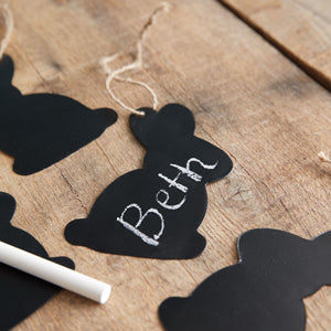 Two chalkboard bunny tags with jute strings and a piece of chalk, perfect for personalized Easter decorations.