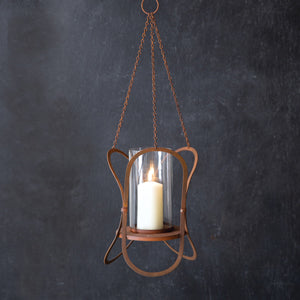 Rustic hanging lantern with a unique rusty finish, perfect for outdoor gatherings, adding charm and warmth to any setting.