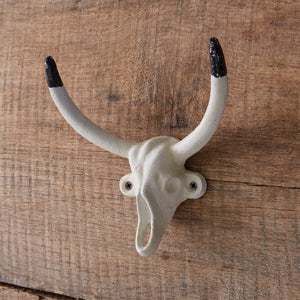 Western Bull Hook with two horns, crafted from cast iron with a painted finish, adds rustic charm and functionality to any room.