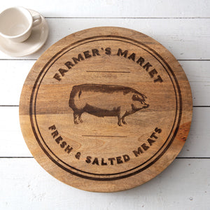 Wooden lazy susan with "Farmer's Market Fresh Salted Meats" text and pig illustration, perfect for rustic dining settings.