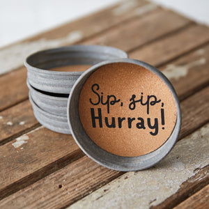 Set of four Mason jar lid coasters with elegant waterproof prints and cork interiors, perfect for protecting surfaces stylishly.