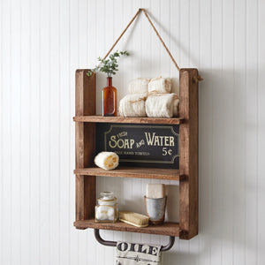 Vintage-inspired bathroom shelf with a towel bar, featuring a classic design for organized storage and enhanced bathroom style.