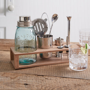 A 10-piece mason jar bar set with a mason jar shaker, stainless steel shaker, and tools, neatly arranged on an MDF stand.