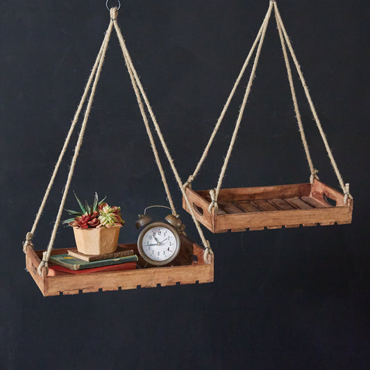 Set of two hanging wood shelves with a modern design, suspended by ropes, showcasing a stylish and functional home decor solution.