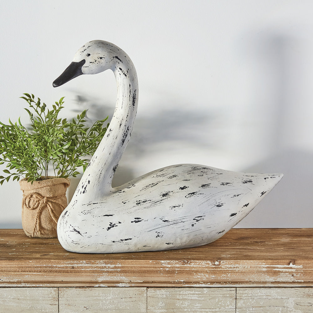 Primitive swan statue